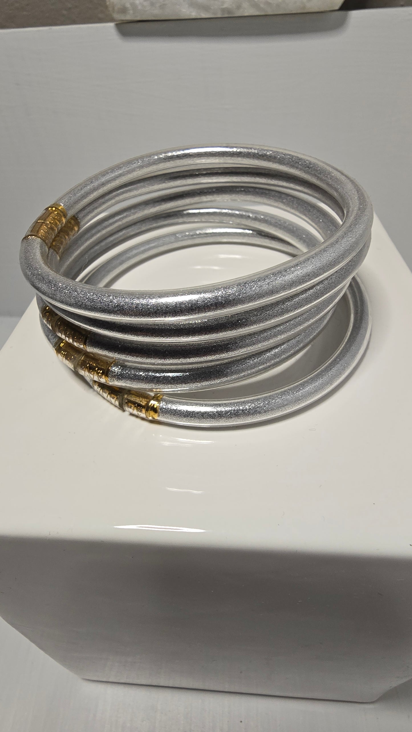 Set of 5 Plastic Silver Tone Bangle Bracelets with Gold Accents